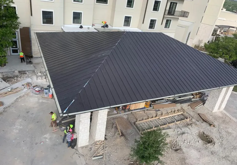 Metal roofing installation team working on a commercial building in Elko