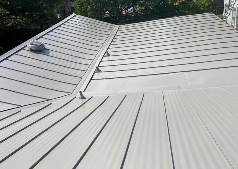 Solar attic fan installed on a metal roof for Roof Ventilation in Elko